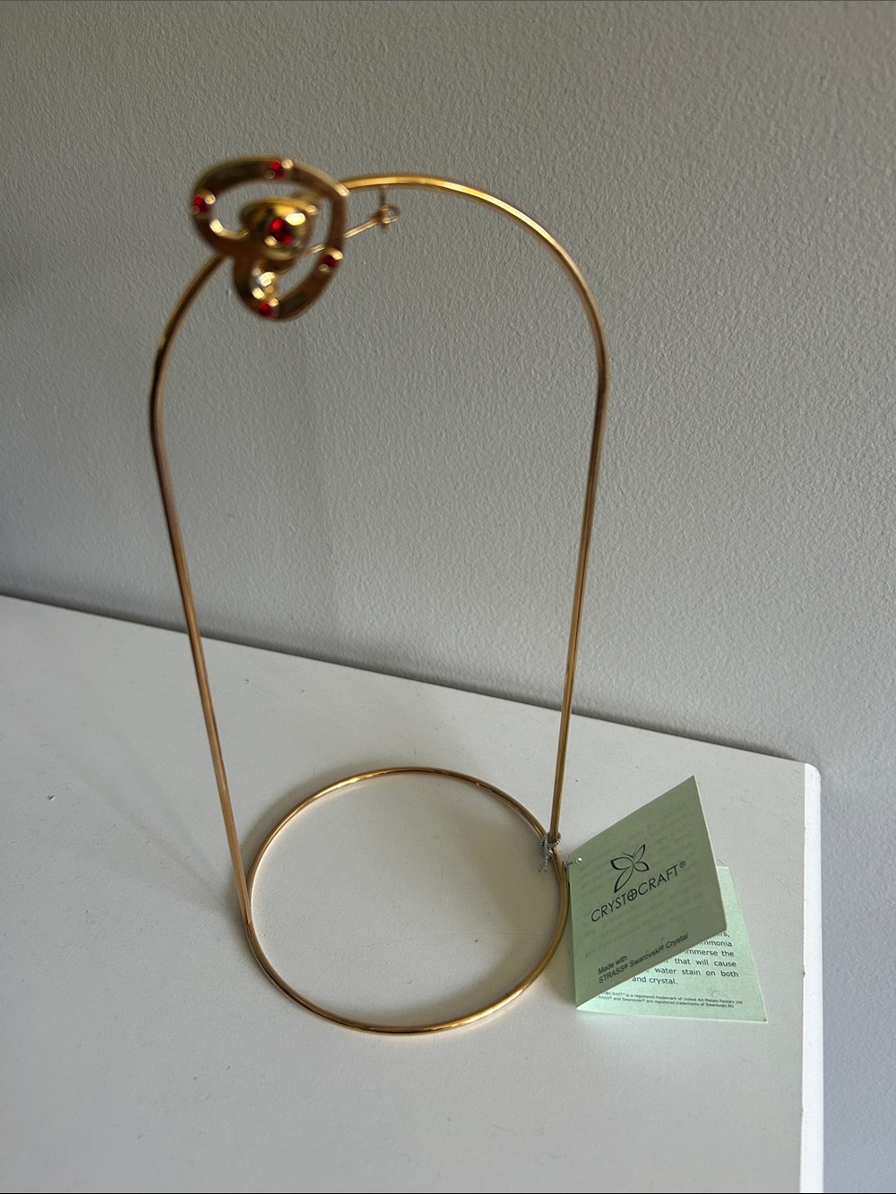 Gold Ornament Display Stand with Red Accents